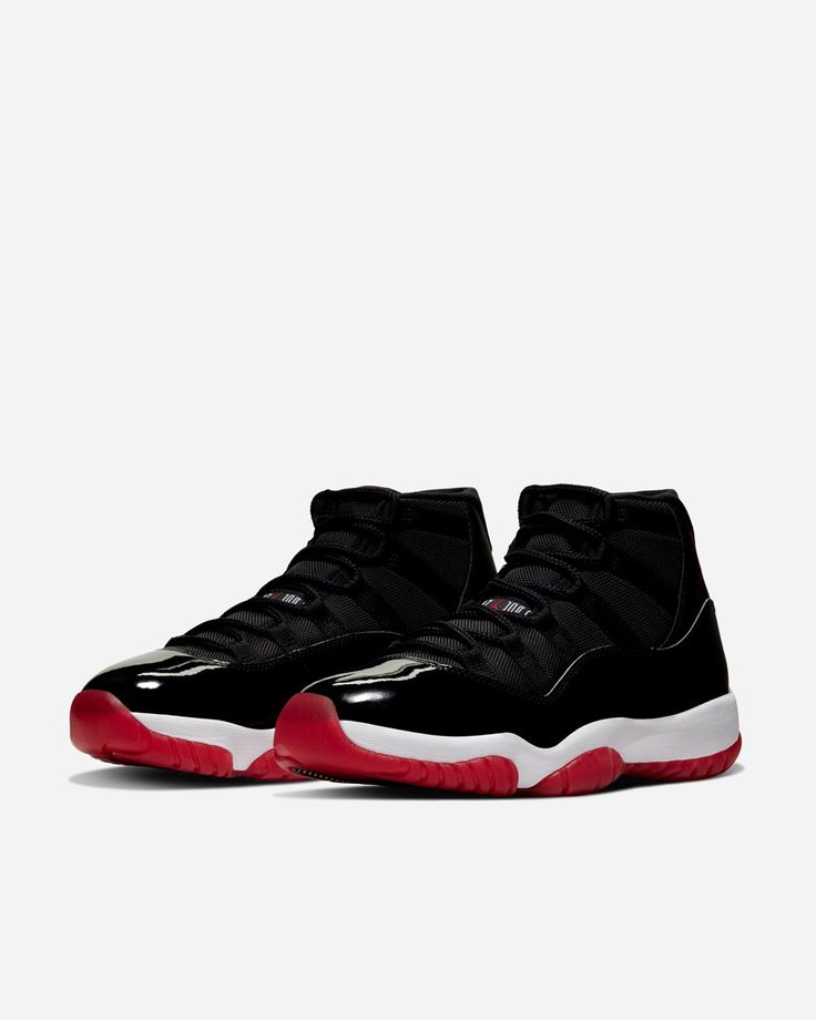 Black Air Jordan high-top sneakers with white midsoles and red outsoles