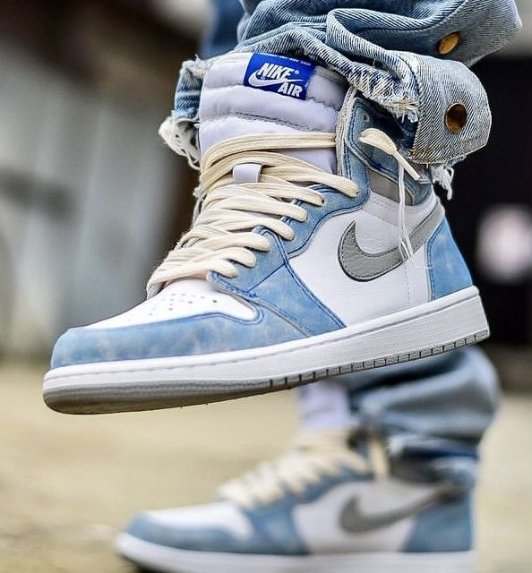 Pale blue sneaker styled with denim